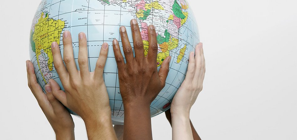 The IPD team Four hands hold a globe